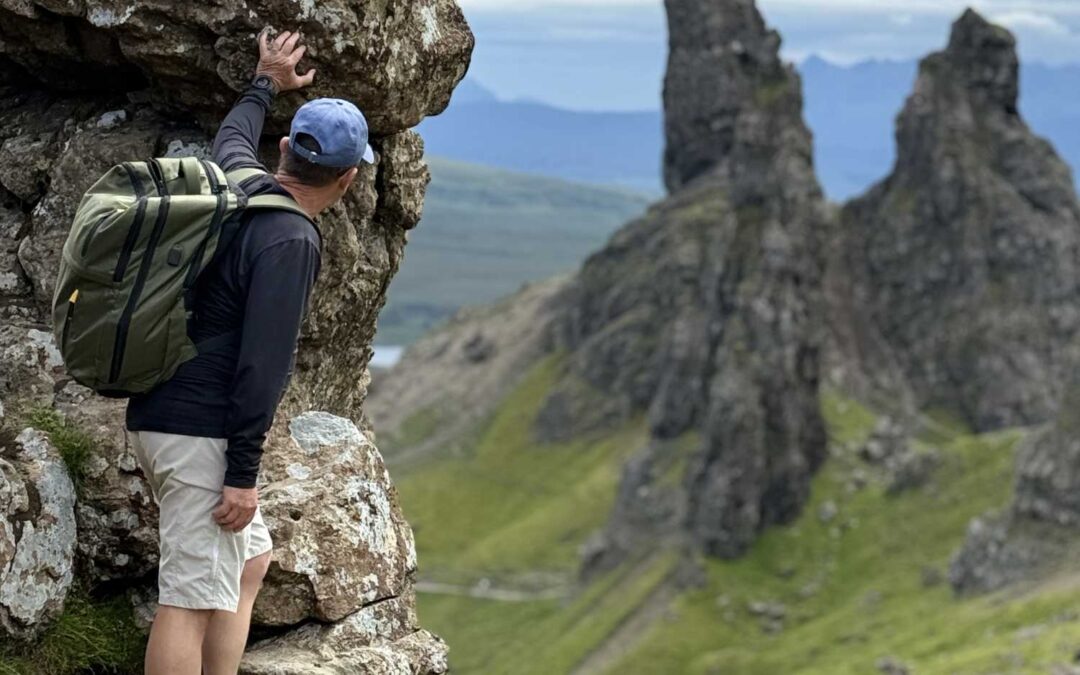 tourist discovering hidden old man of storr viewpoint