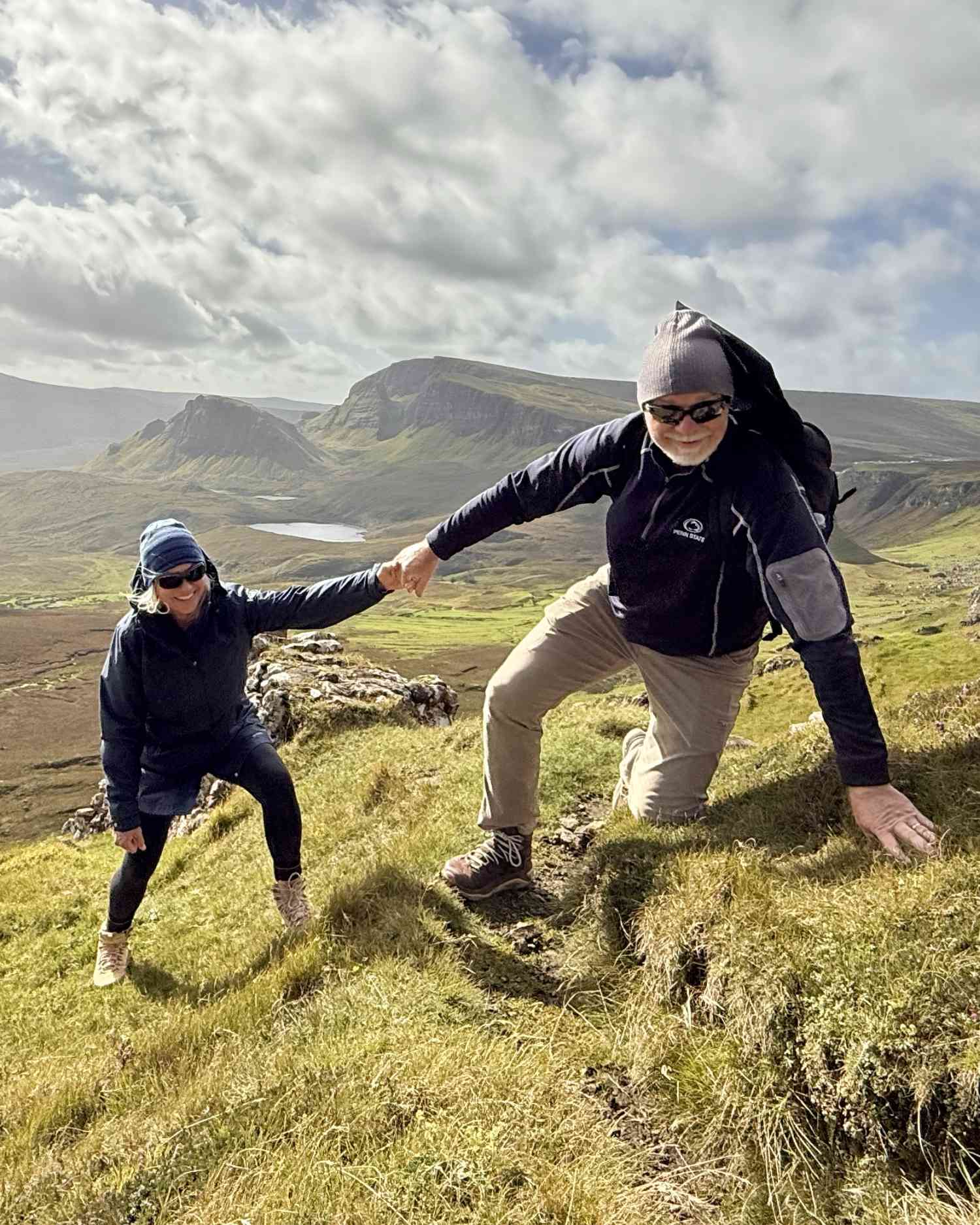 hikers exploring Quiraing trail Isle of Skye